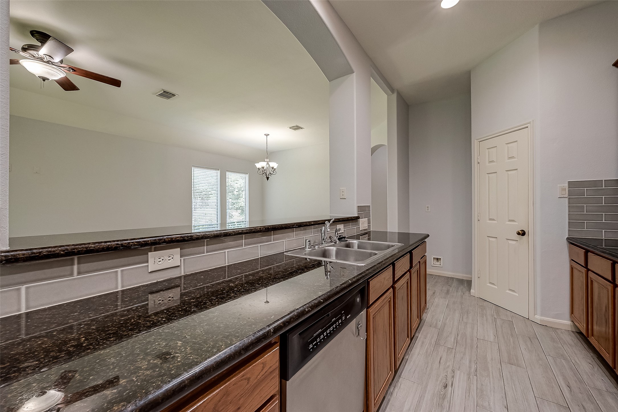 18302 North Elizabeth Shore Loop Cypress, TX 77433 - Photo 17 of 41 a kitchen with a sink stove and cabinets