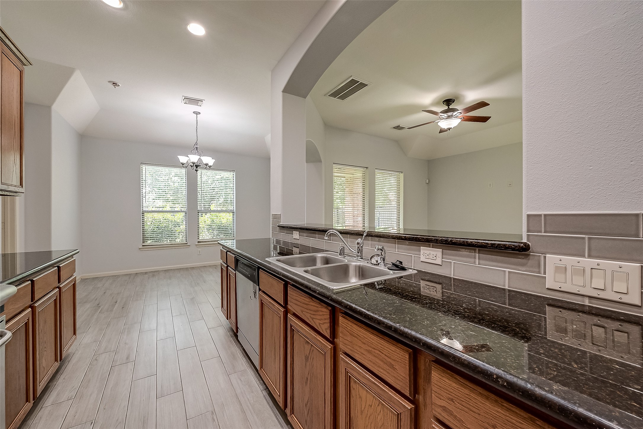 18302 North Elizabeth Shore Loop Cypress, TX 77433 - Photo 19 of 41 a kitchen with a sink and stove