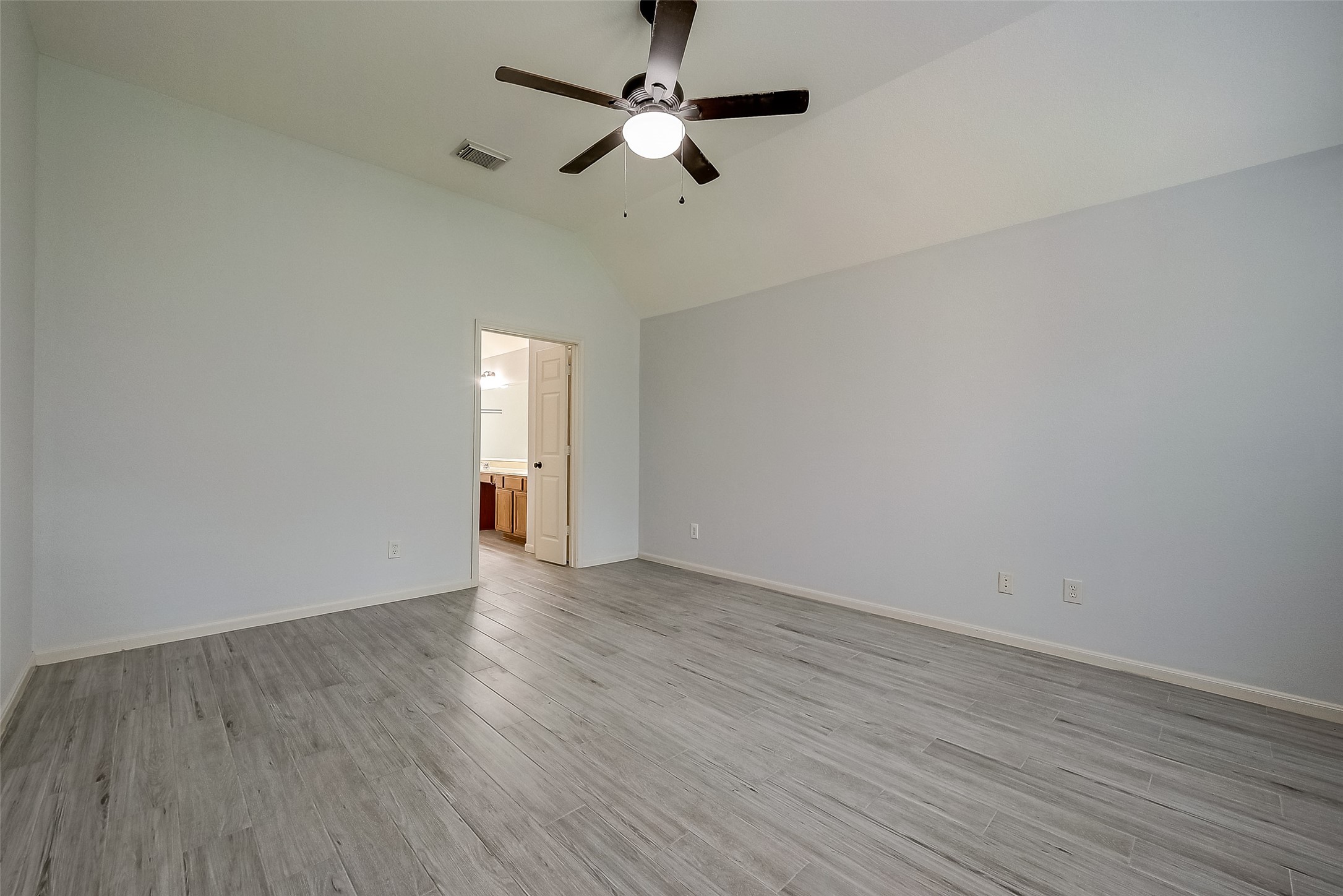 18302 North Elizabeth Shore Loop Cypress, TX 77433 - Photo 22 of 41 a view of an empty room with window and wooden floor