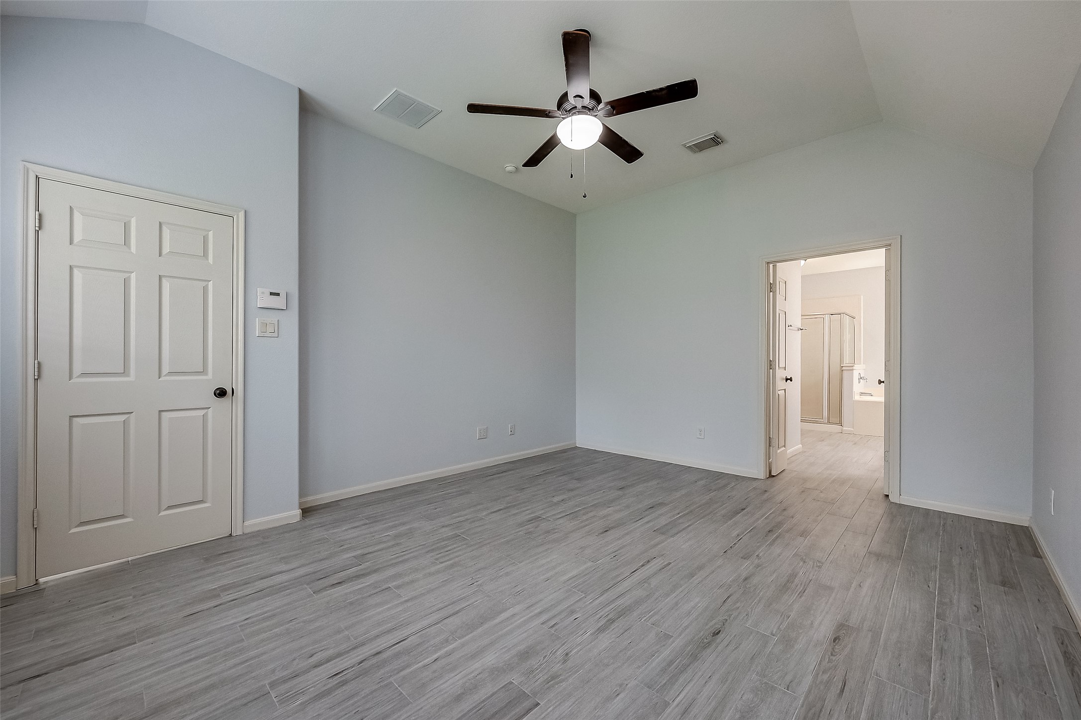 18302 North Elizabeth Shore Loop Cypress, TX 77433 - Photo 23 of 41 a view of an empty room with wooden floor