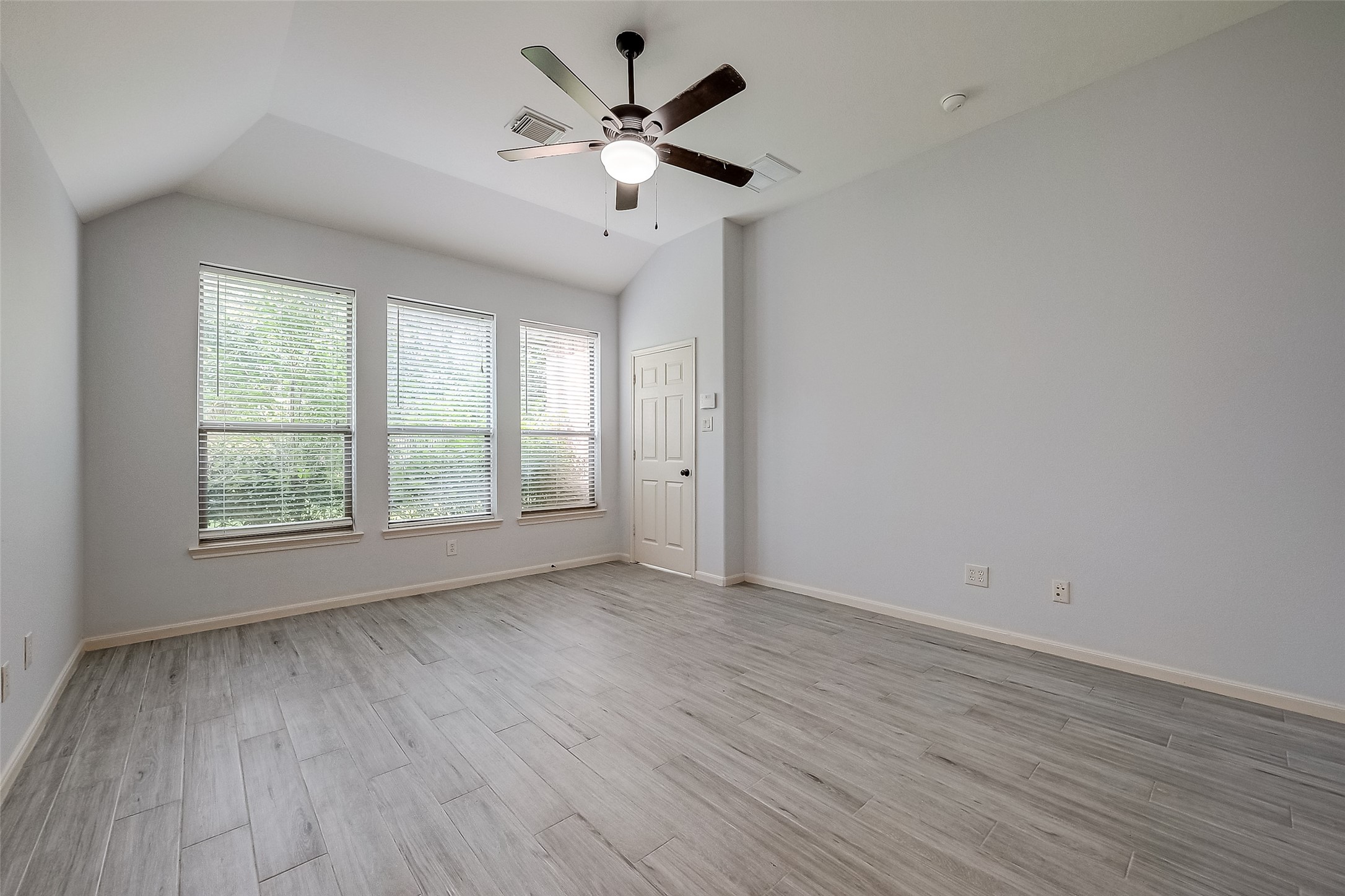 18302 North Elizabeth Shore Loop Cypress, TX 77433 - Photo 24 of 41 wooden floor in an empty room with a window
