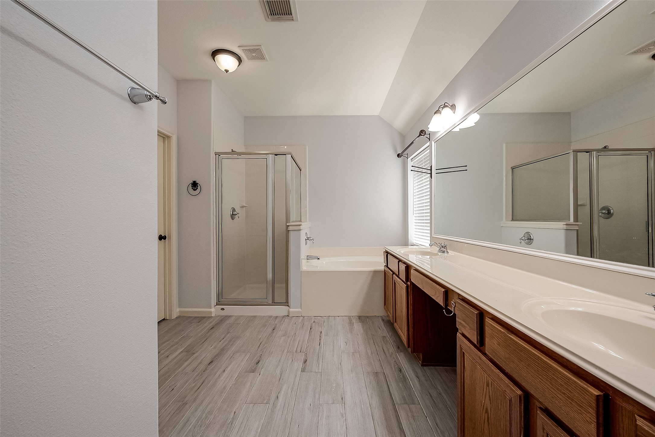 18302 North Elizabeth Shore Loop Cypress, TX 77433 - Photo 26 of 41 a spacious bathroom with a granite countertop sink a toilet a shower and a mirror