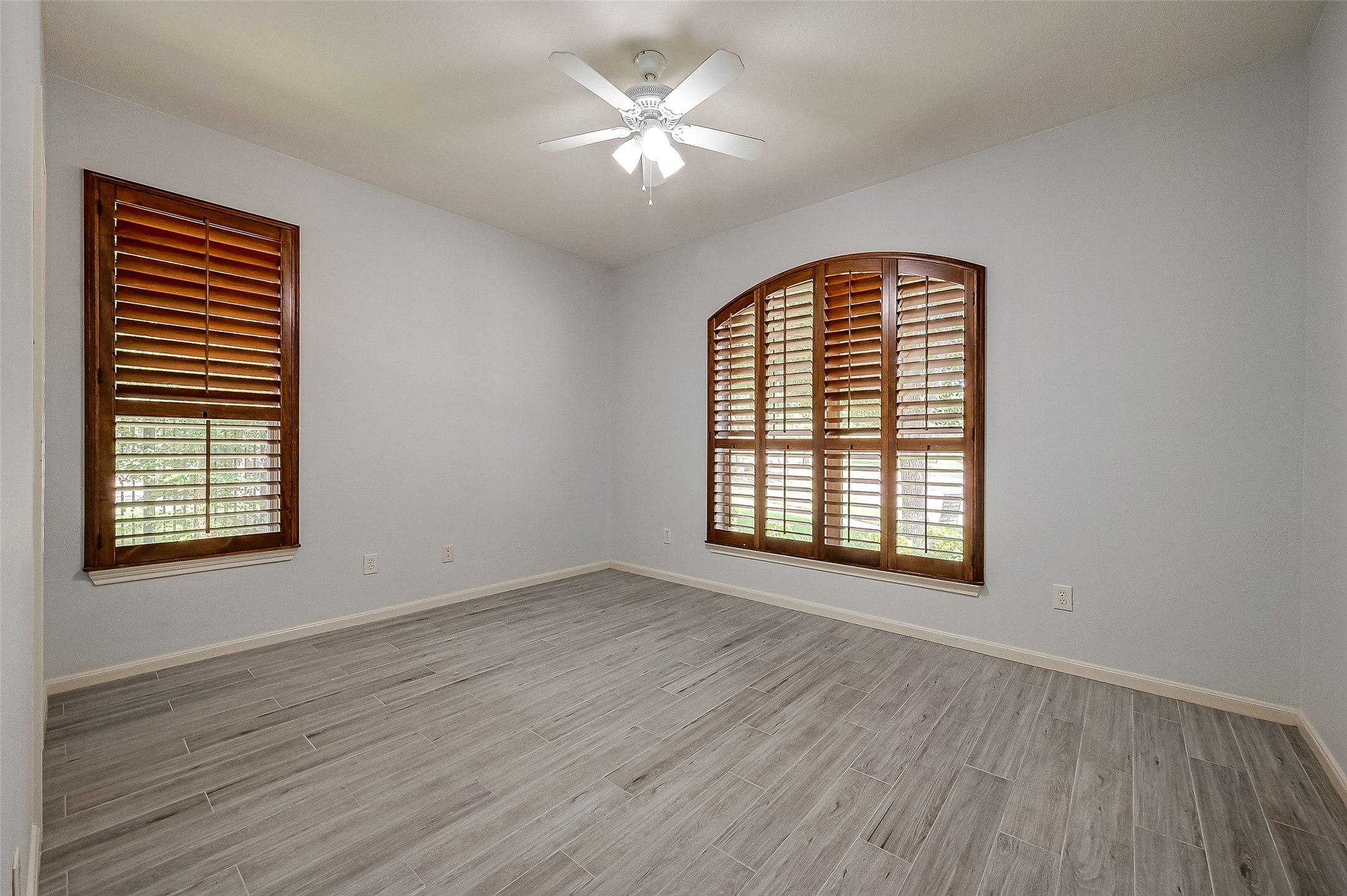 18302 North Elizabeth Shore Loop Cypress, TX 77433 - Photo 31 of 41 a view of an empty room with exposed radiator and a window