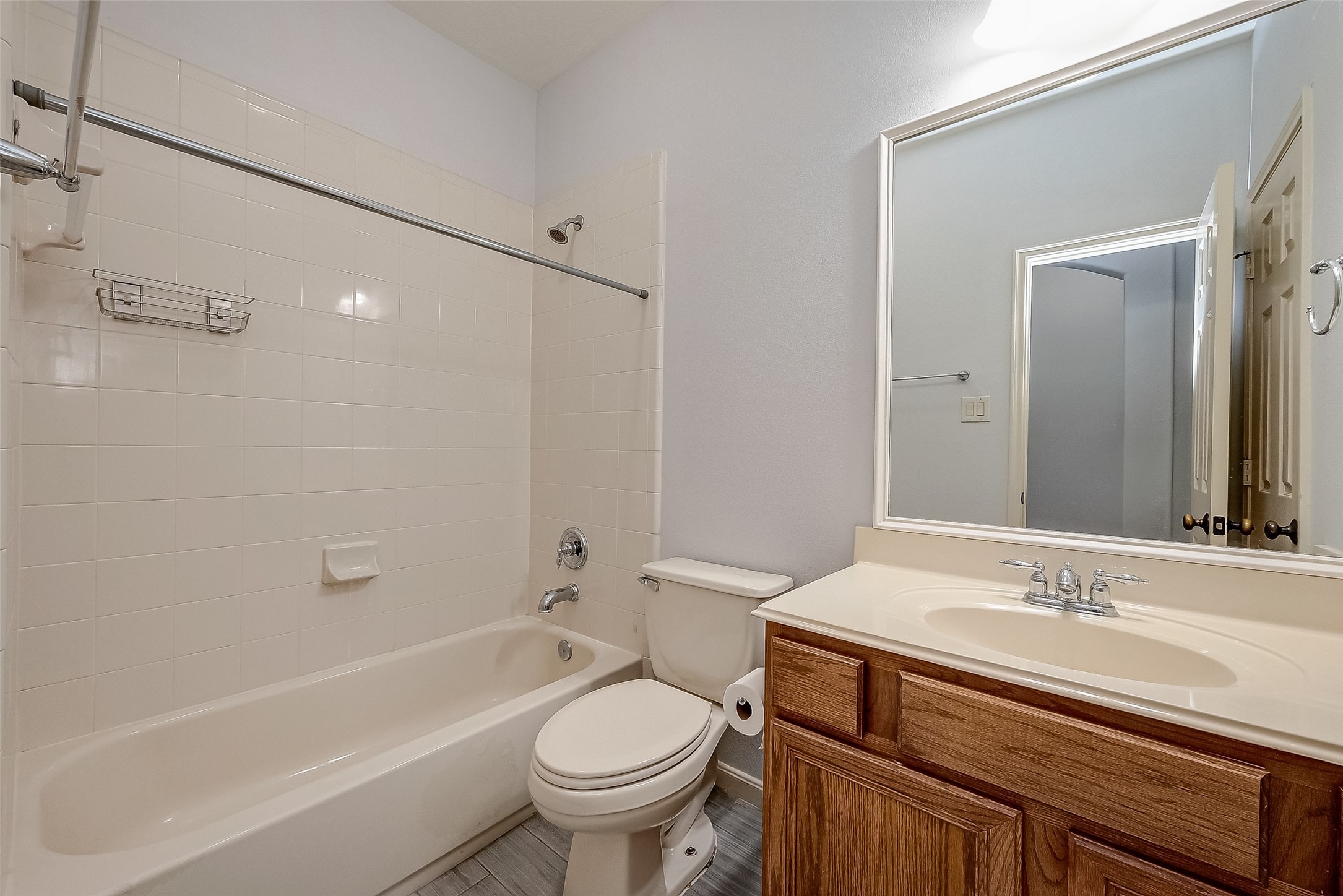 18302 North Elizabeth Shore Loop Cypress, TX 77433 - Photo 34 of 41 a bathroom with a sink a toilet and a bathtub