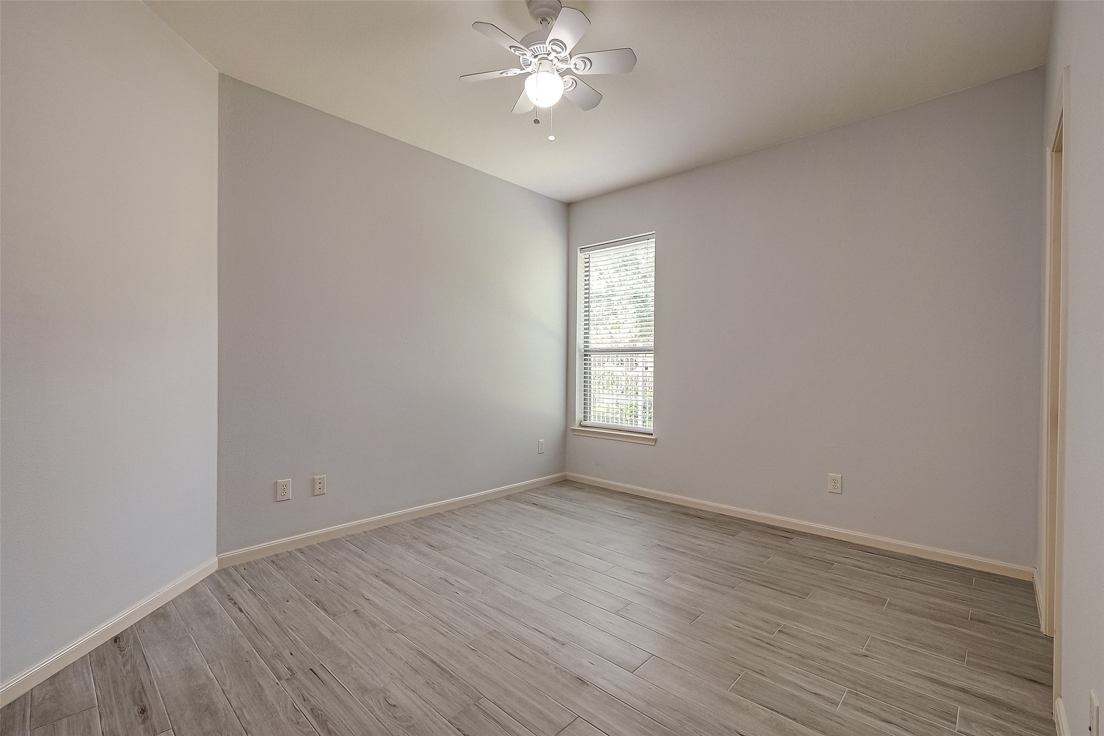 18302 North Elizabeth Shore Loop Cypress, TX 77433 - Photo 35 of 41 wooden floor in an empty room with a window