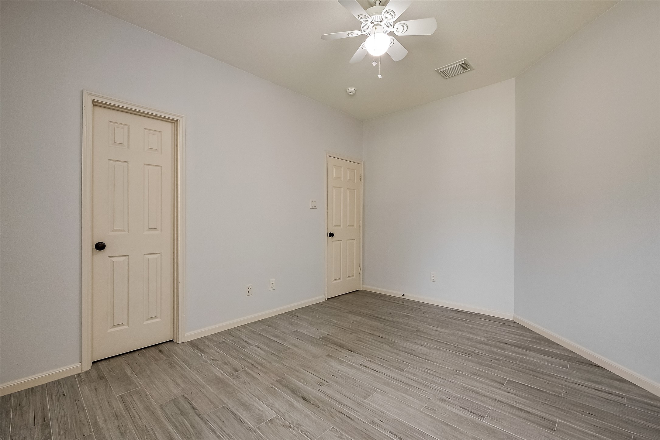 18302 North Elizabeth Shore Loop Cypress, TX 77433 - Photo 36 of 41 a view of an empty room with wooden floor