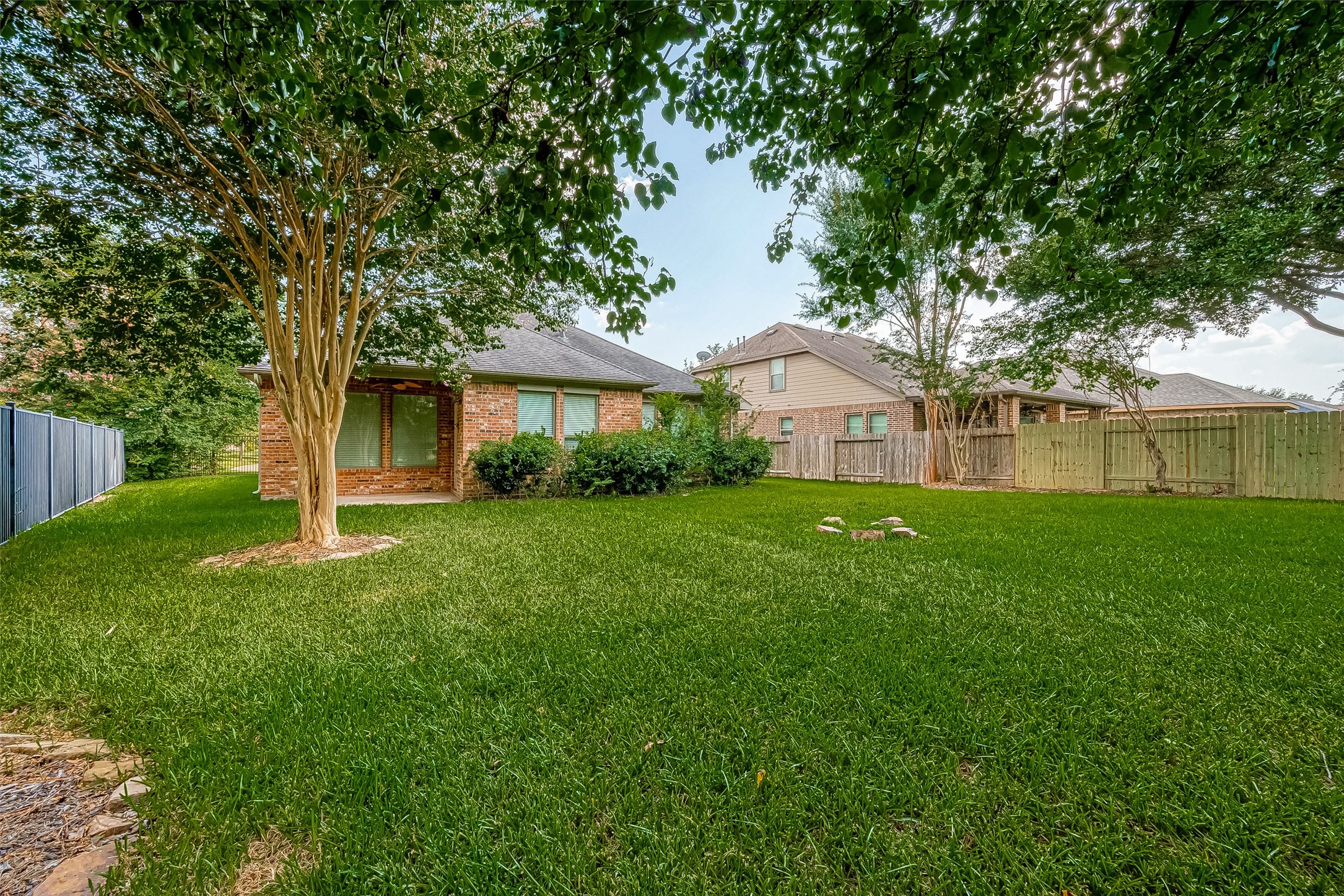 18302 North Elizabeth Shore Loop Cypress, TX 77433 - Photo 39 of 41 a front view of a house with a yard and trees