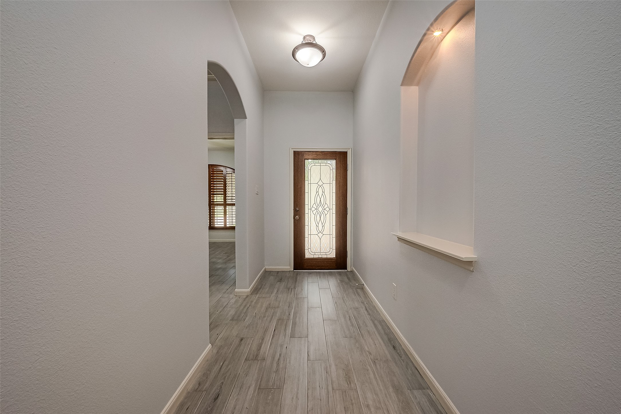 18302 North Elizabeth Shore Loop Cypress, TX 77433 - Photo 6 of 41 a view of hallway with wooden floor