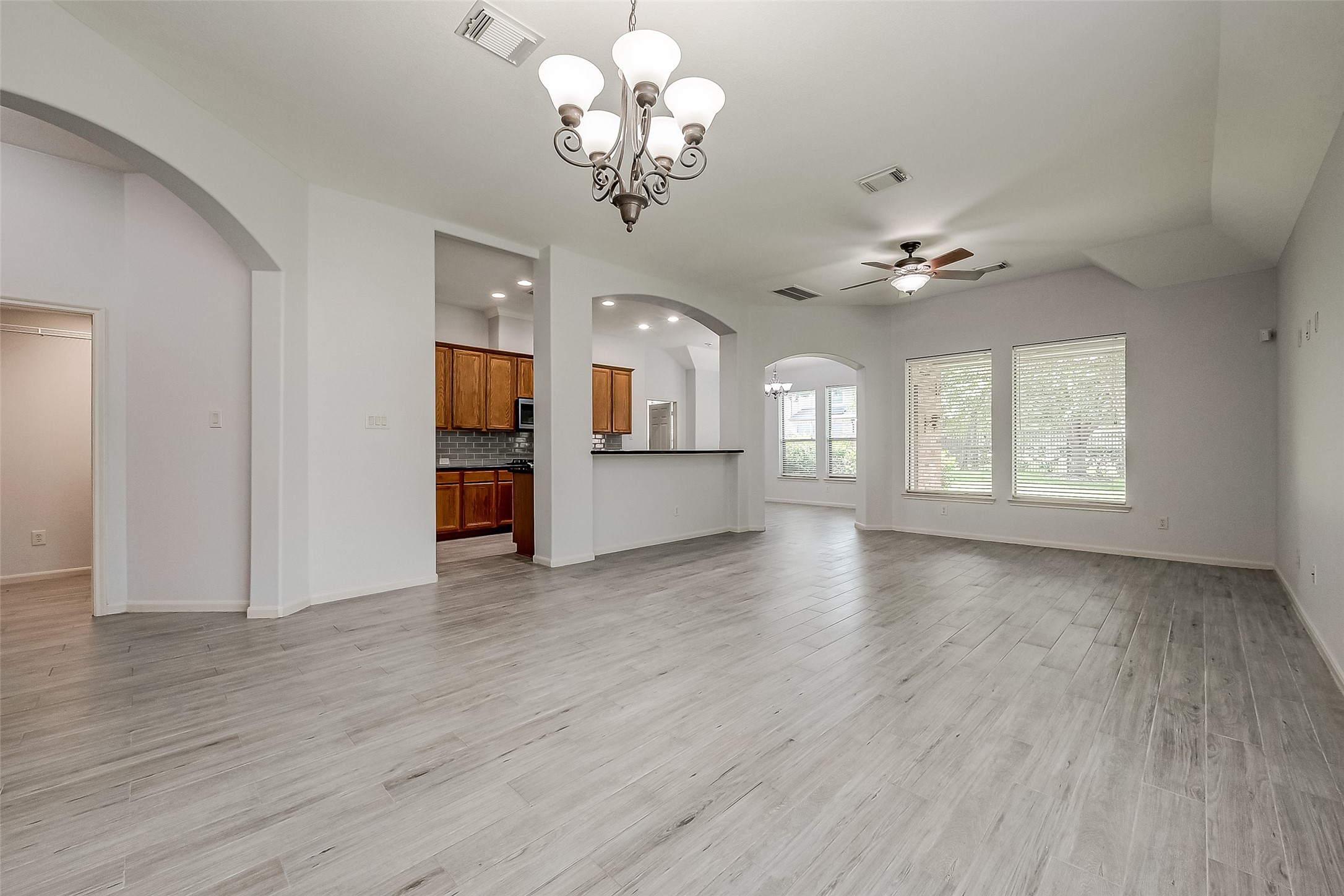 18302 North Elizabeth Shore Loop Cypress, TX 77433 - Photo 8 of 41 wooden floor in an empty room with a window