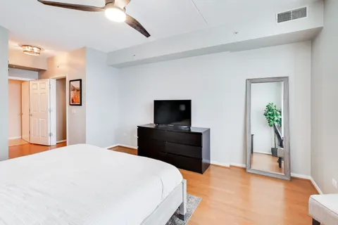 a bedroom with a bed and a dresser