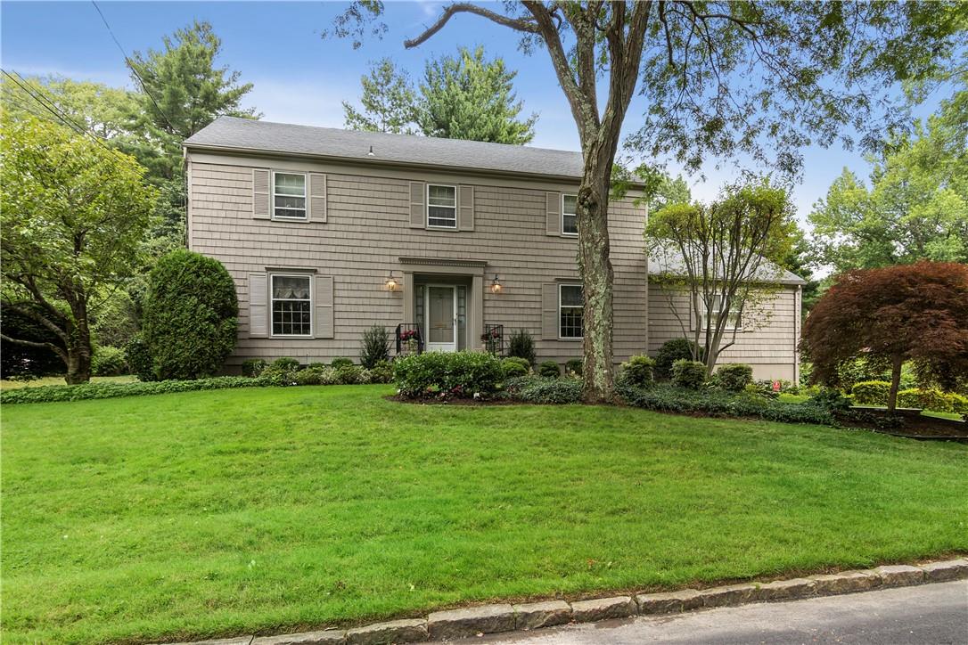 22 Scarsdale Farm Road Scarsdale, NY 10583 - Photo 1 of 1 a front view of a house with a garden