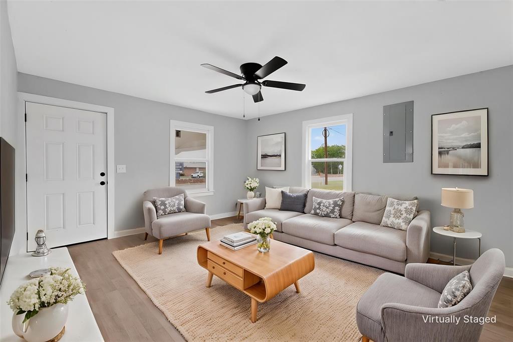 313 Farm To Market 316 Eustace, TX 75124 - Photo 6 of 33 a living room with furniture a ceiling fan and a window
