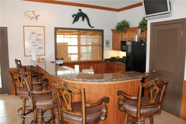 a dining table with chairs and window