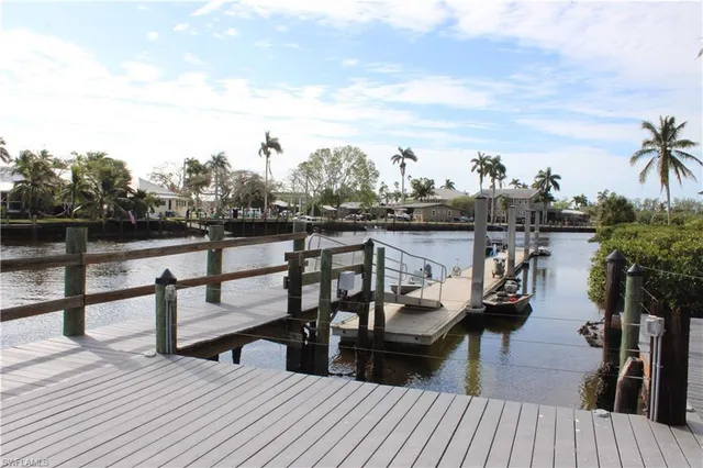 a view of a lake with boats and wooden floor