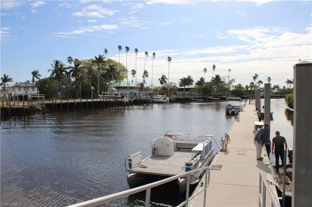 a view of a lake with houses in the back