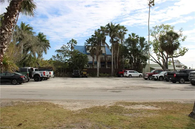 a view of street with parked cars