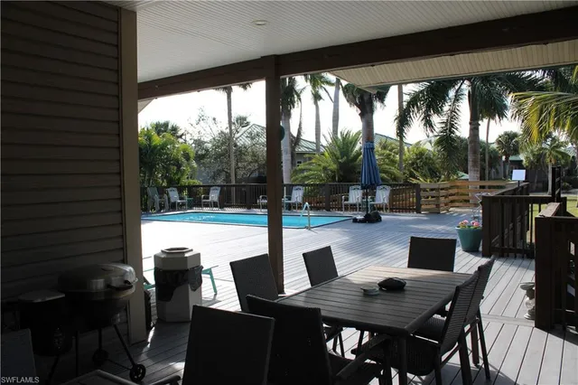 a outdoor dining space with furniture and a potted plant