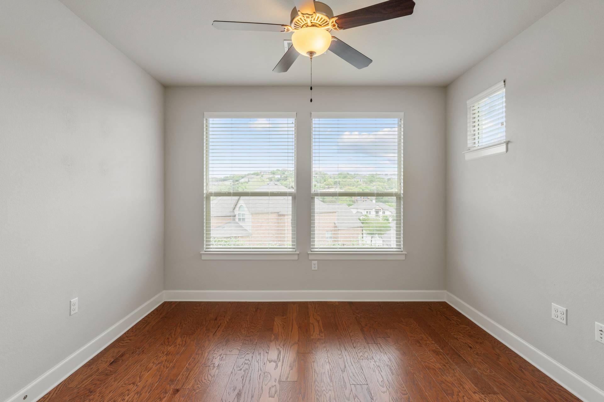 3516 Venezia View Leander, TX 78641 - Photo 28 of 40 Spare room featuring dark wood-style flooring and a ceiling fan