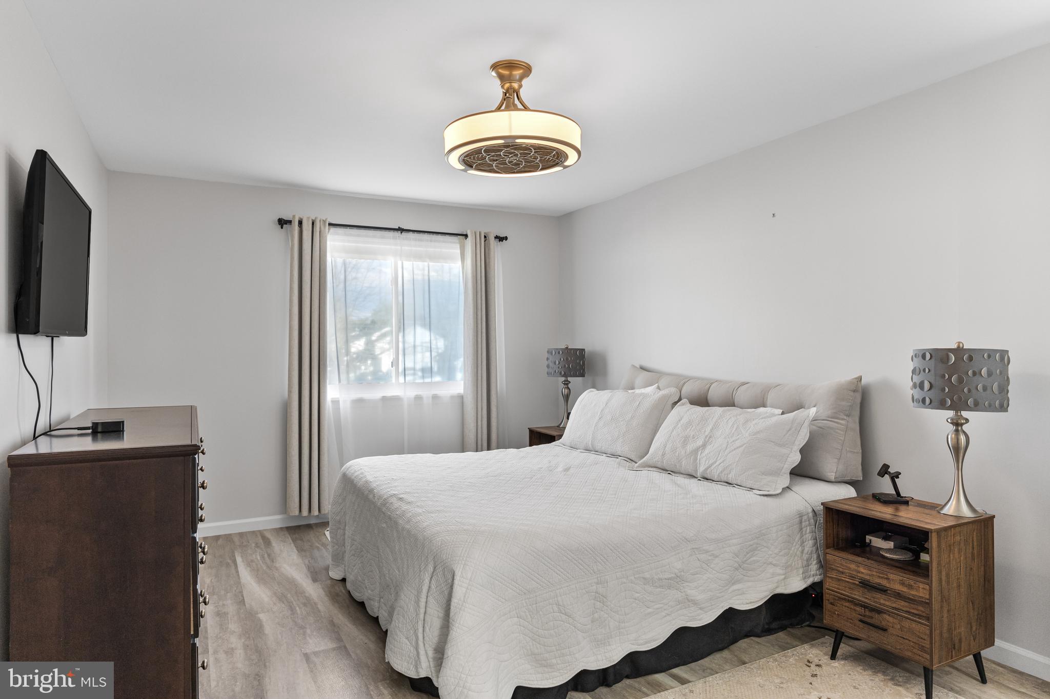 15 Ginger Drive Lumberton, NJ 08048 - Photo 20 of 30 a bedroom with a bed and a flat screen tv