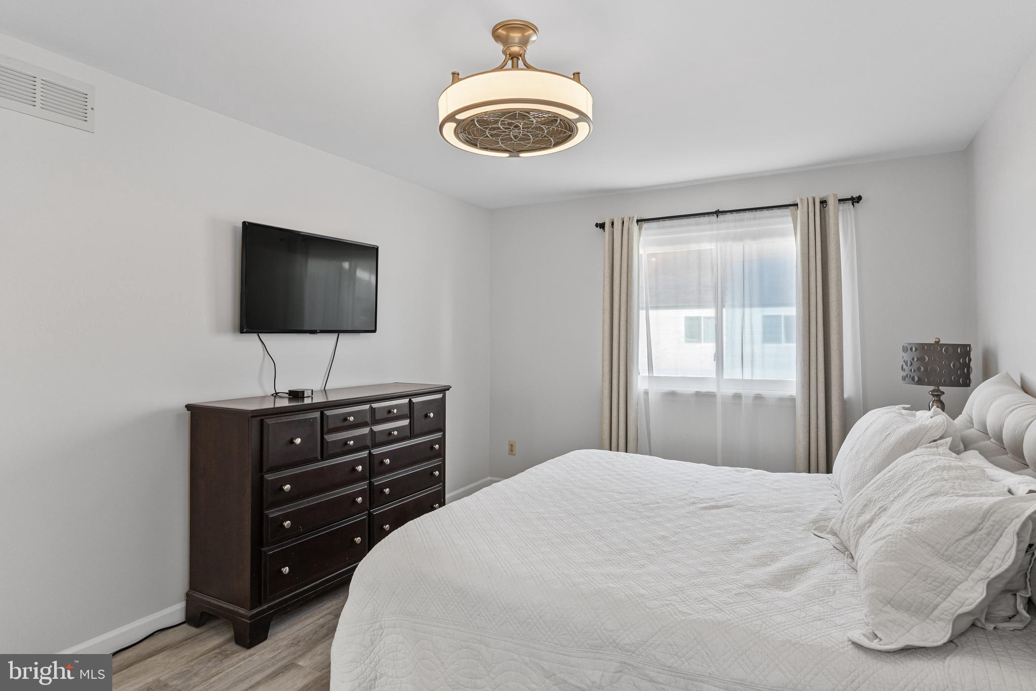 15 Ginger Drive Lumberton, NJ 08048 - Photo 21 of 30 a bedroom with a bed and a flat screen tv