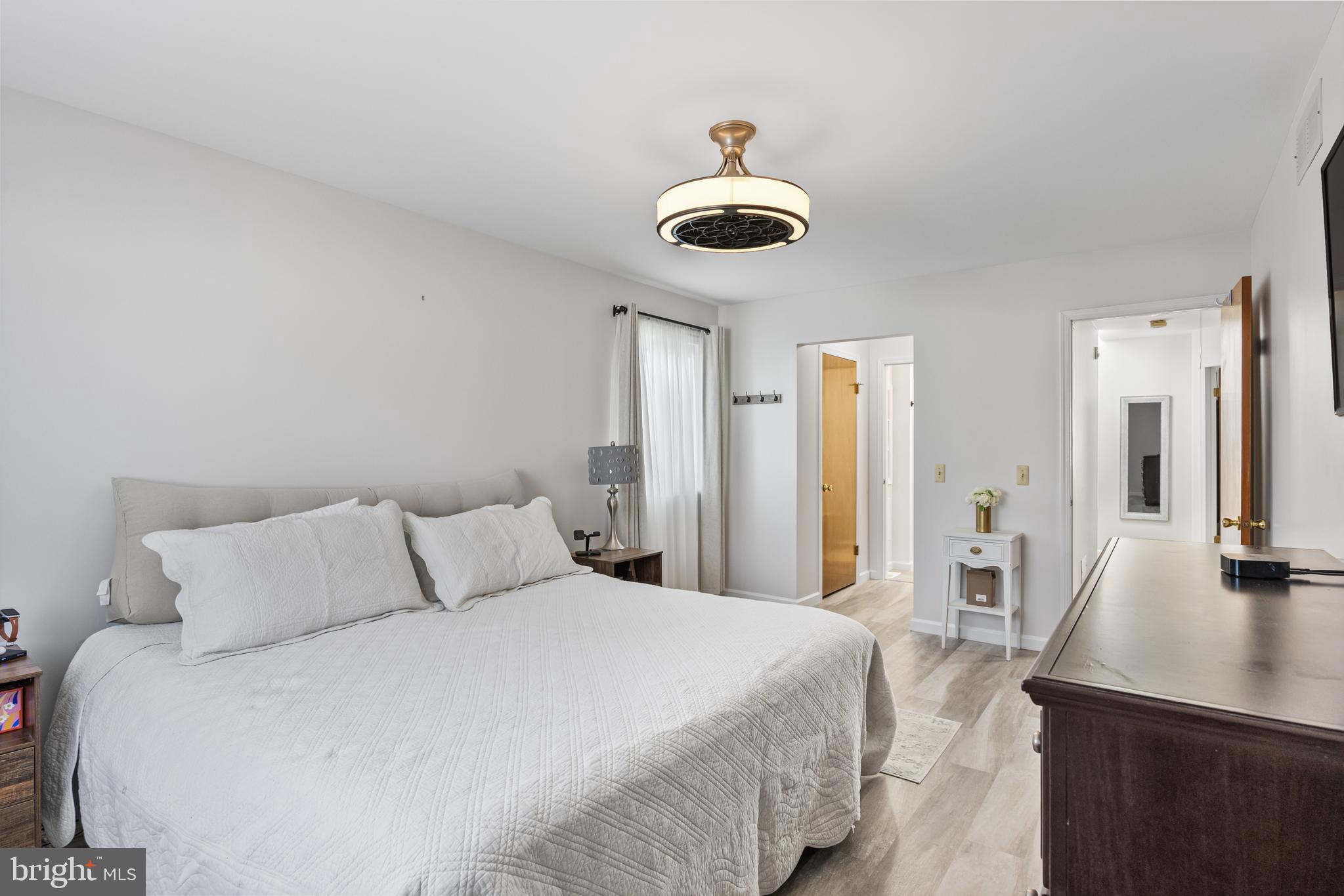 15 Ginger Drive Lumberton, NJ 08048 - Photo 22 of 30 a bedroom with a bed and a chandelier
