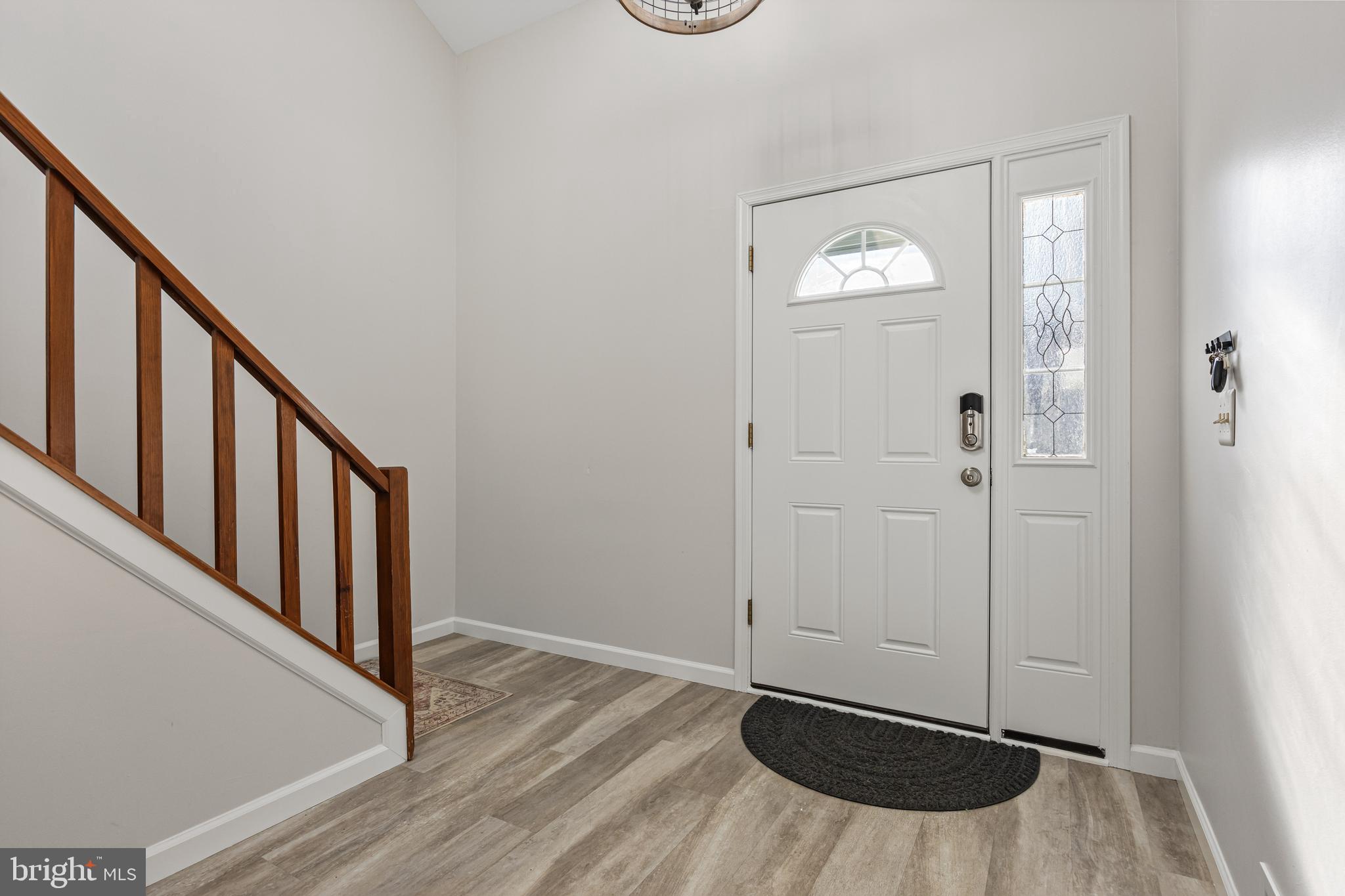 15 Ginger Drive Lumberton, NJ 08048 - Photo 4 of 30 a view of a hallway with wooden floor and staircase