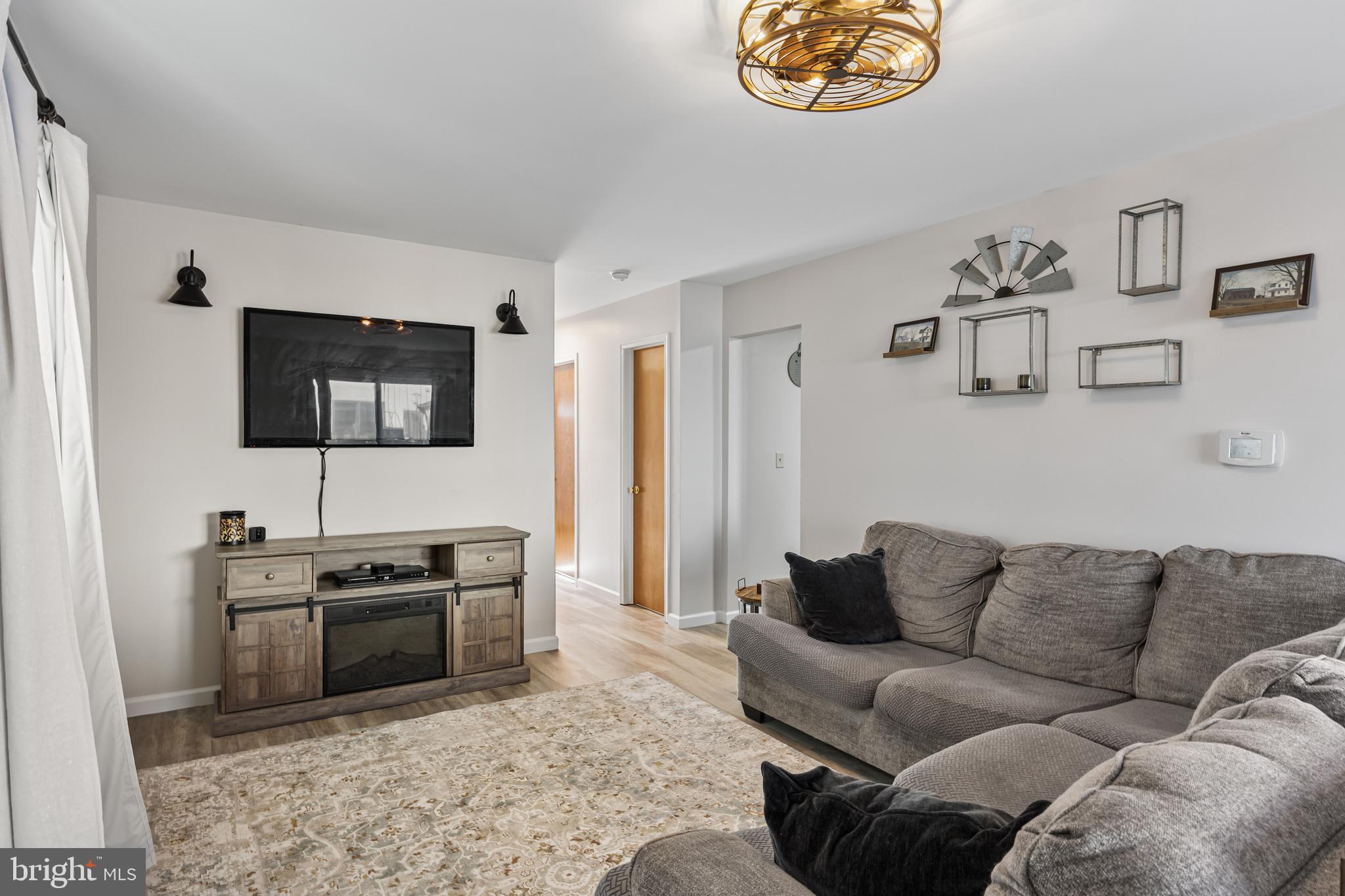 15 Ginger Drive Lumberton, NJ 08048 - Photo 8 of 30 a living room with furniture and a flat screen tv
