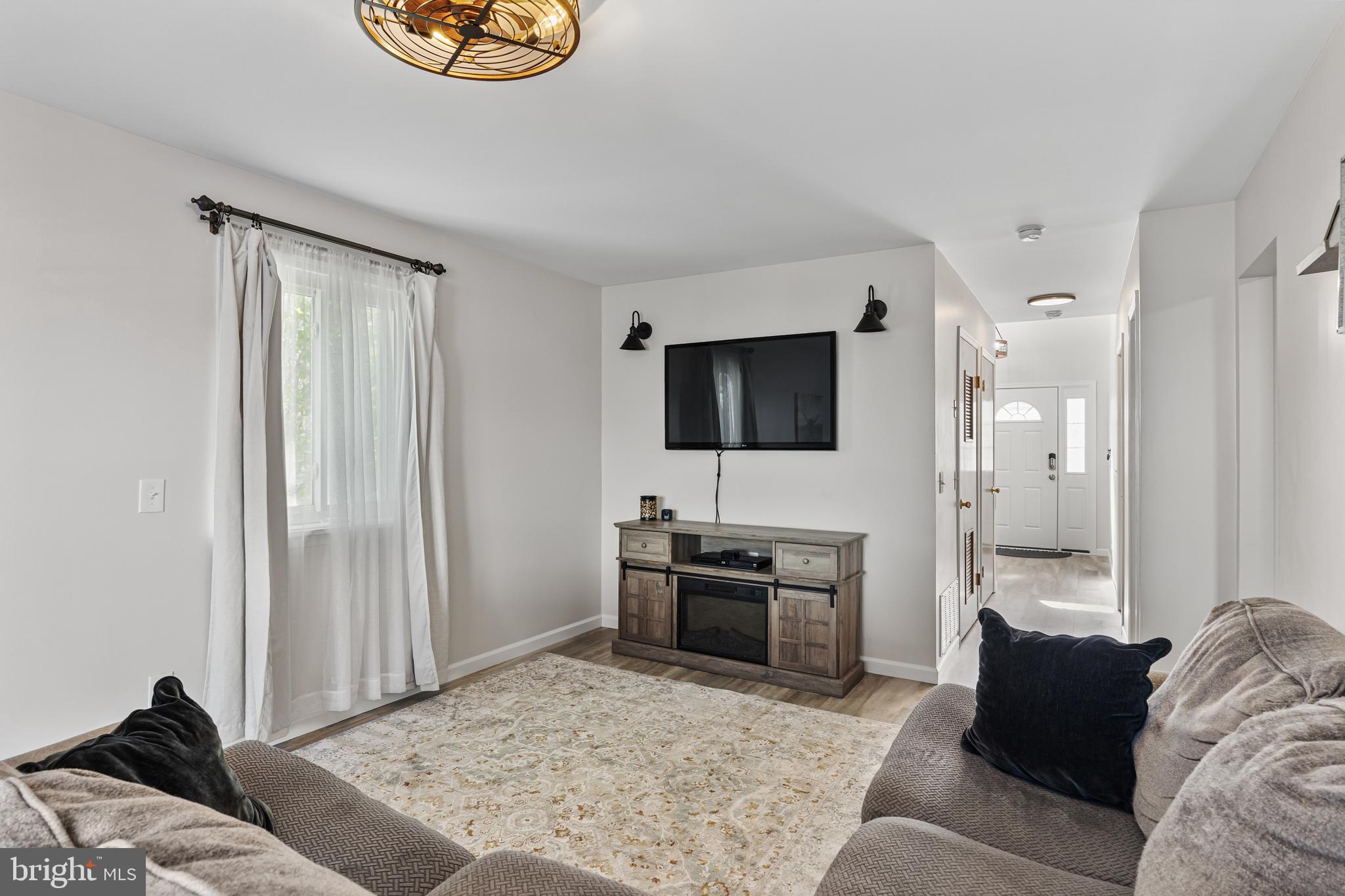 15 Ginger Drive Lumberton, NJ 08048 - Photo 9 of 30 a living room with furniture and a flat screen tv