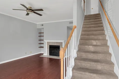 a bedroom with bed plant and window
