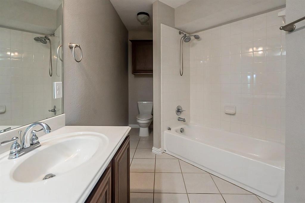 4433 Paula Ridge Court Fort Worth, TX 76137 - Photo 17 of 24 a bathroom with a sink a toilet and shower
