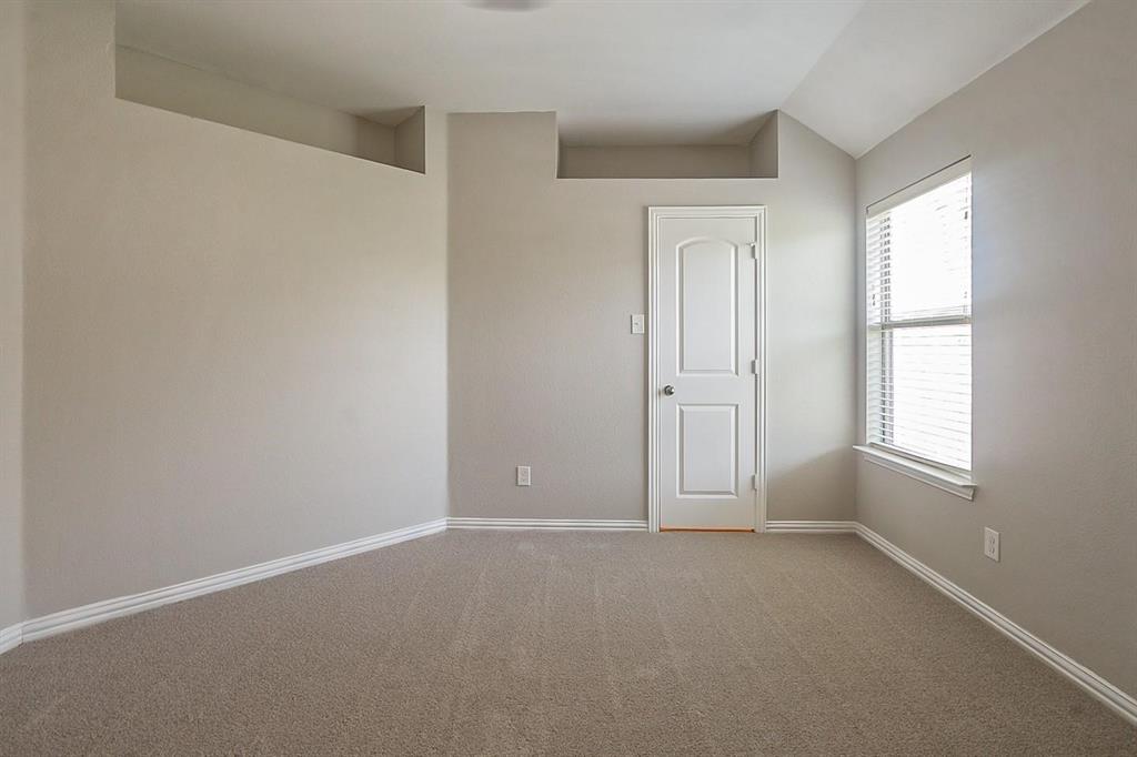 4433 Paula Ridge Court Fort Worth, TX 76137 - Photo 19 of 24 an empty room with windows and closet