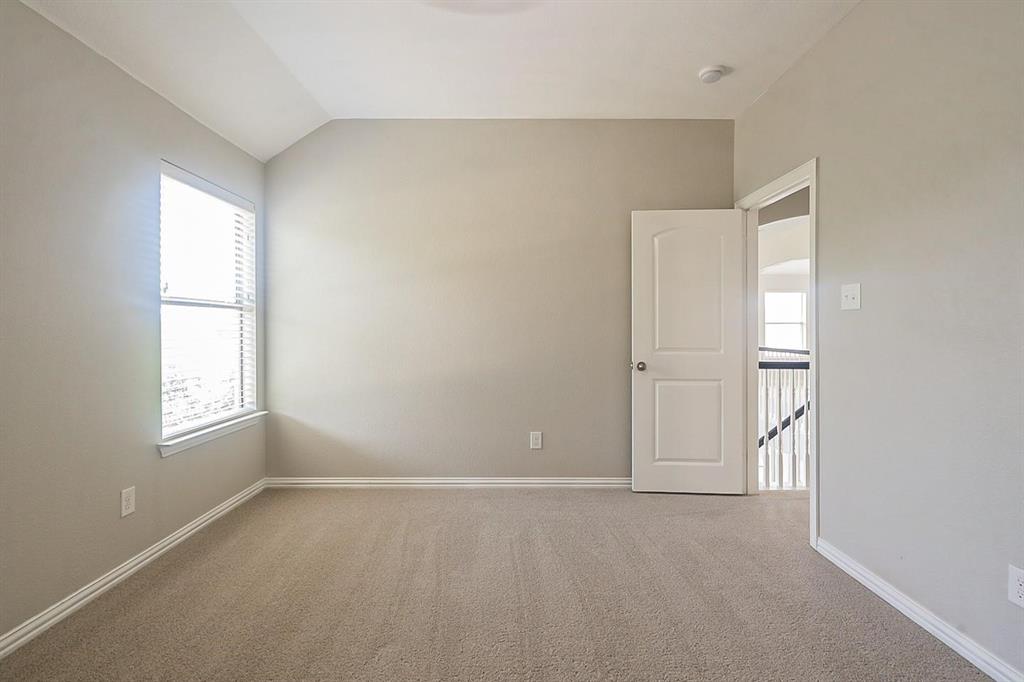 4433 Paula Ridge Court Fort Worth, TX 76137 - Photo 21 of 24 an empty room with windows and closet