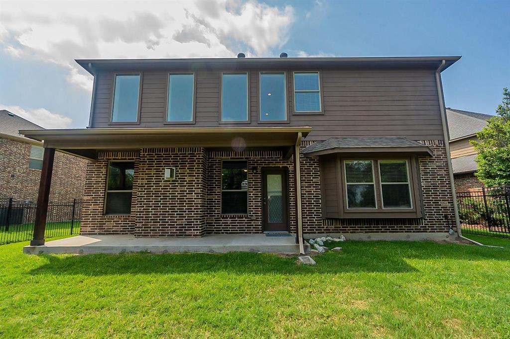 4433 Paula Ridge Court Fort Worth, TX 76137 - Photo 22 of 24 front view of a house with a yard