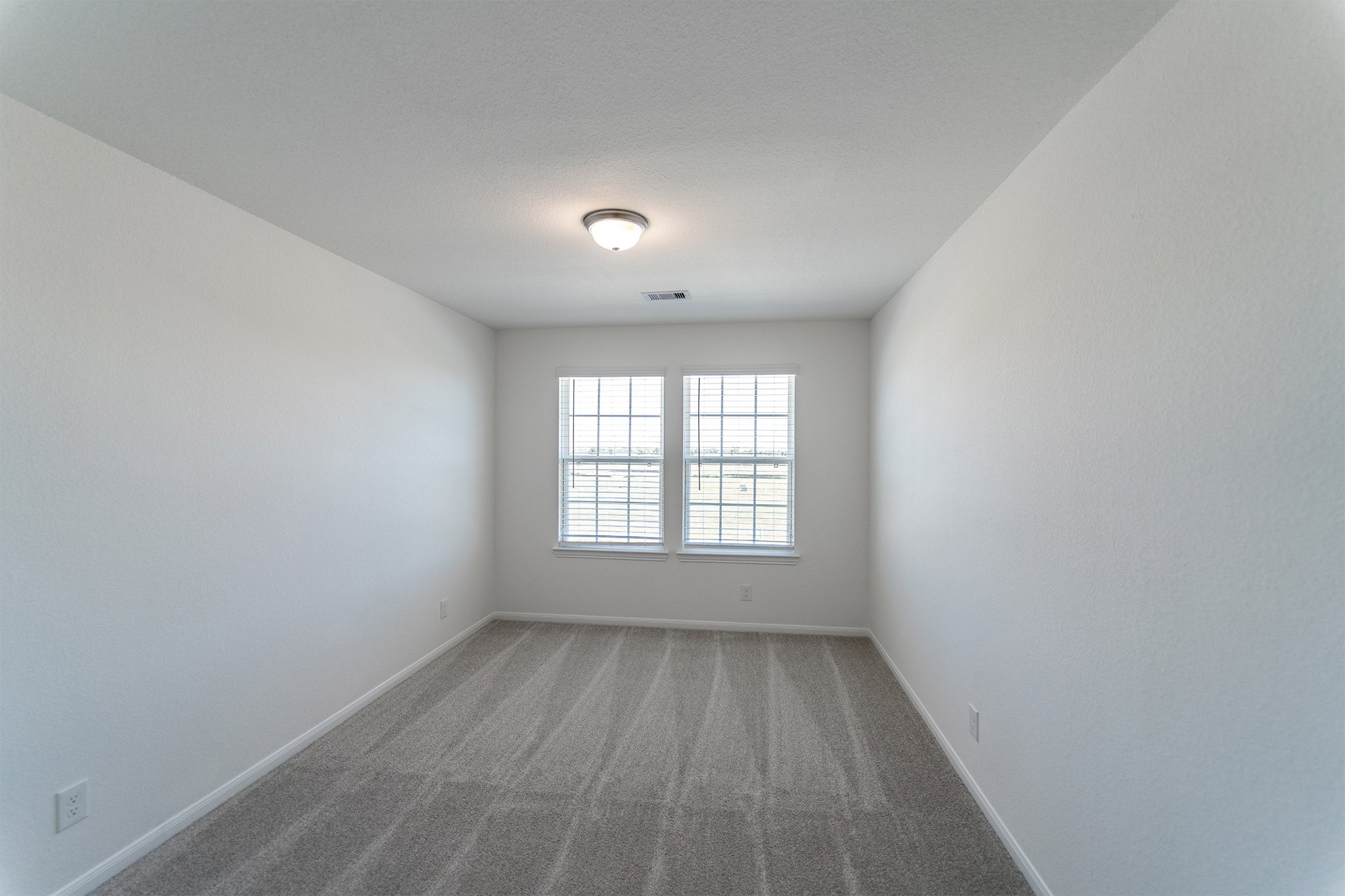 438 Hazy Meadows Drive Beasley, TX 77417 - Photo 13 of 21 an empty room with wooden floor and windows