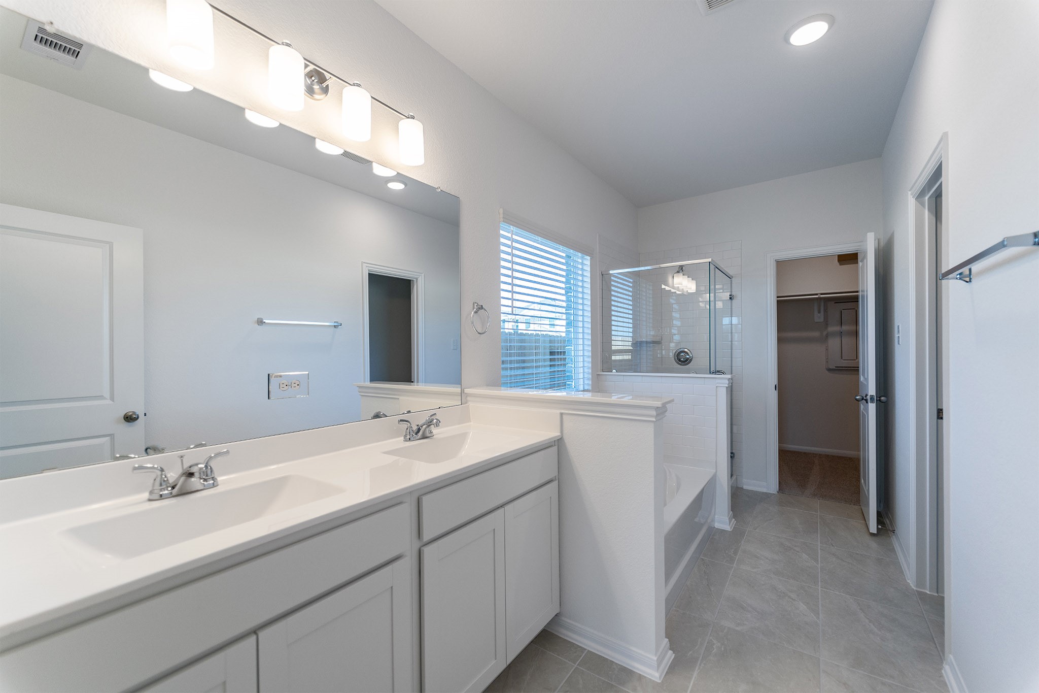 438 Hazy Meadows Drive Beasley, TX 77417 - Photo 16 of 21 a spacious bathroom with a double vanity sink mirror and double