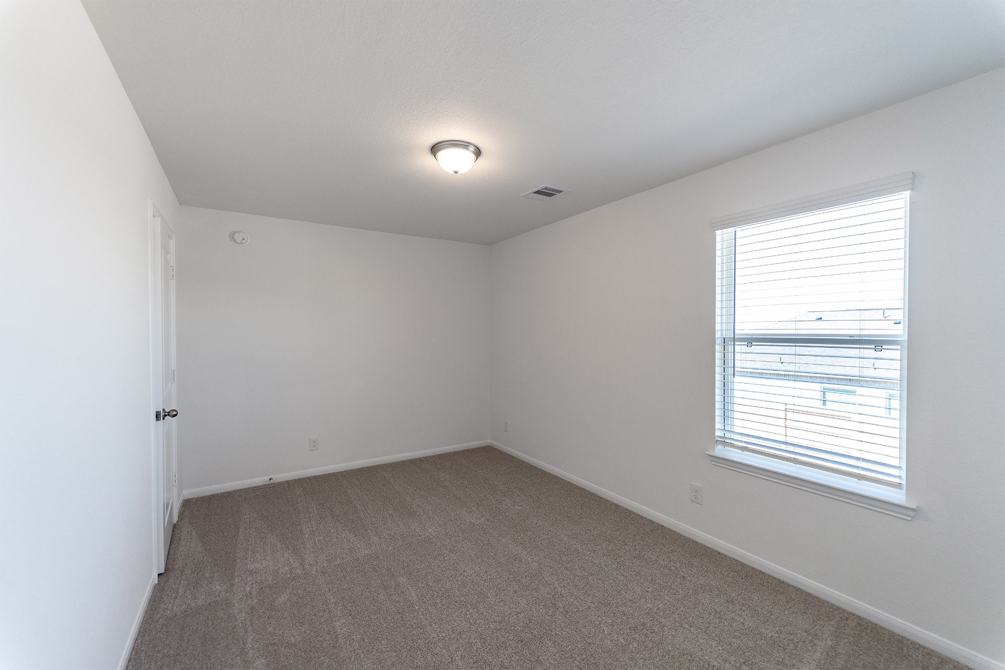 438 Hazy Meadows Drive Beasley, TX 77417 - Photo 21 of 21 an empty room with a window