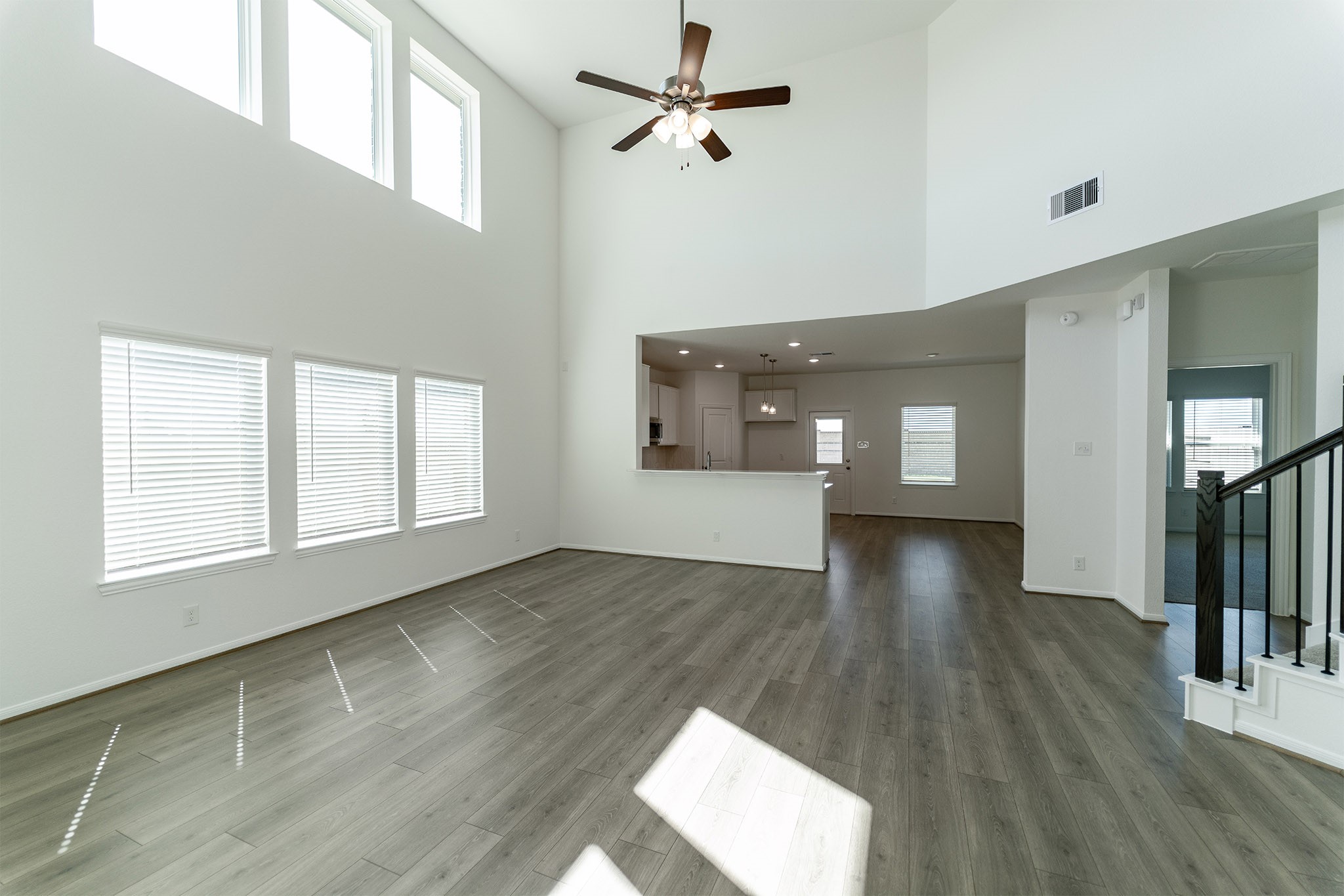 438 Hazy Meadows Drive Beasley, TX 77417 - Photo 3 of 21 wooden floor in an empty room with a window