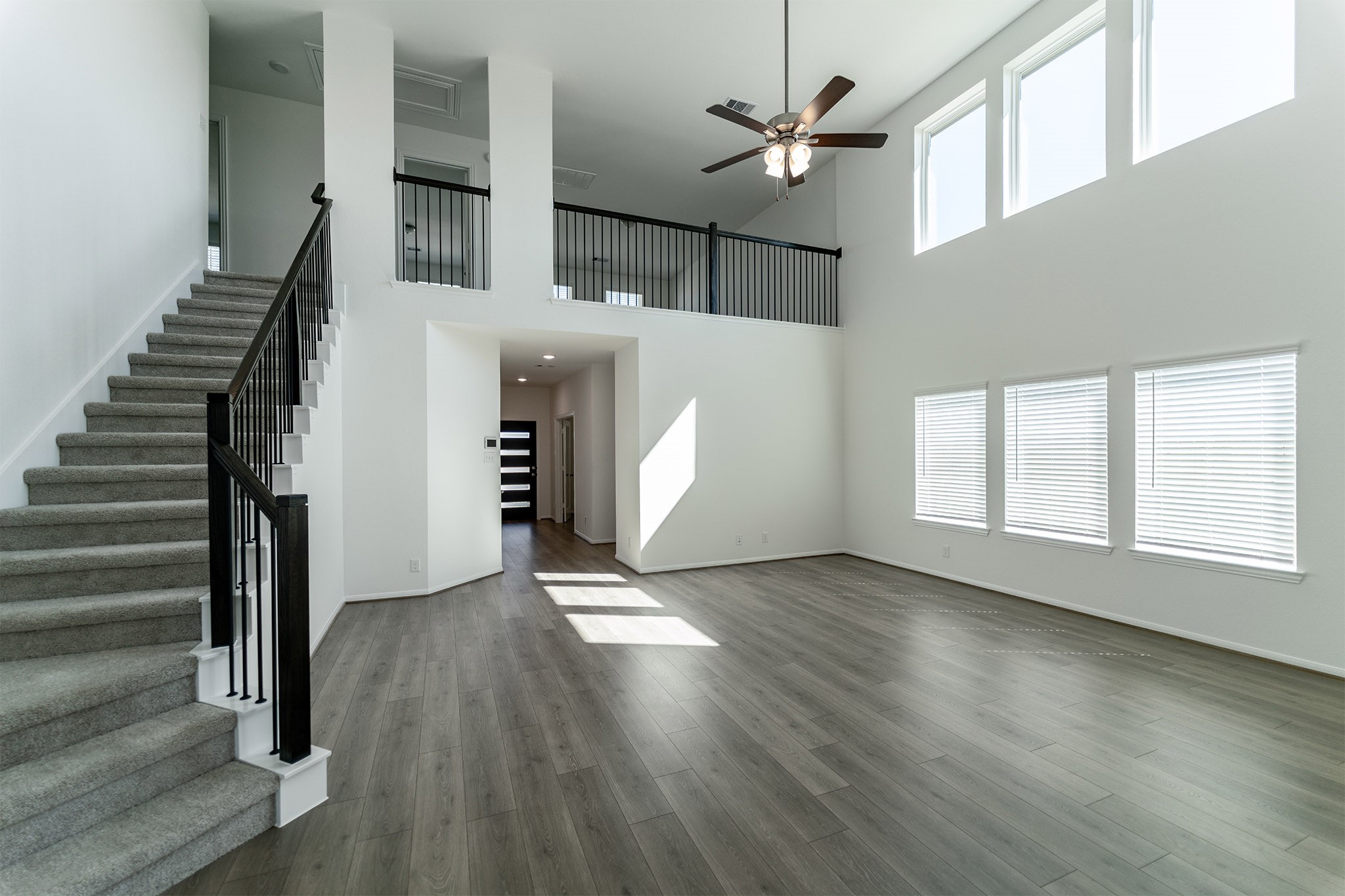 438 Hazy Meadows Drive Beasley, TX 77417 - Photo 4 of 21 wooden floor in an empty room with a window