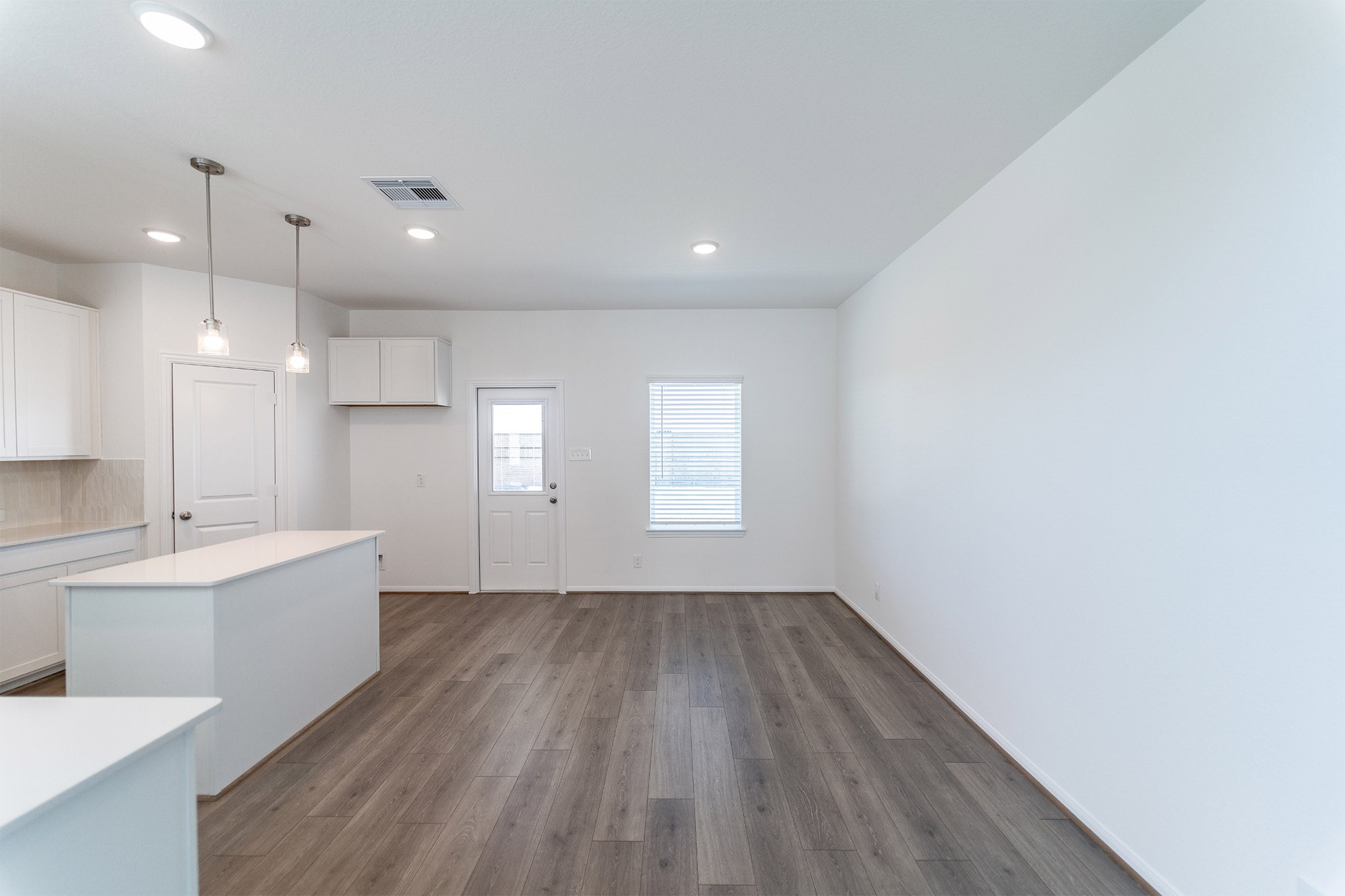 438 Hazy Meadows Drive Beasley, TX 77417 - Photo 7 of 21 a view of kitchen with a sink wooden floor and window
