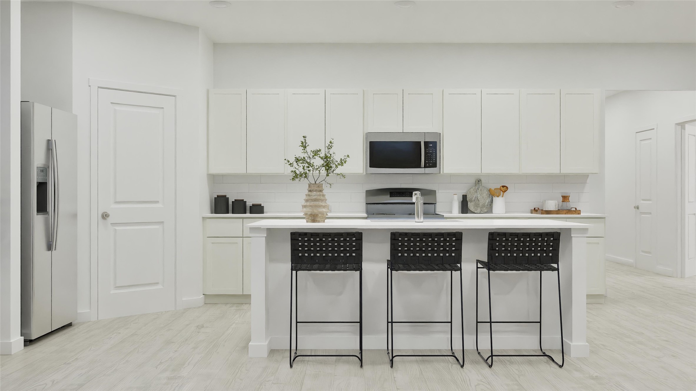 135 Outrigger Way Kyle, TX 78640 - Photo 16 of 33 a kitchen with stainless steel appliances a stove microwave and cabinets