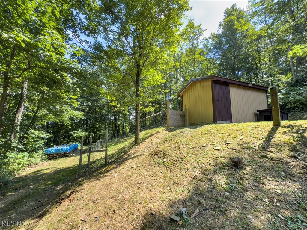 34390 Barber Ridge Road Lewisville, OH 43754 - Photo 34 of 50 View of yard with an outdoor structure and view of scattered trees