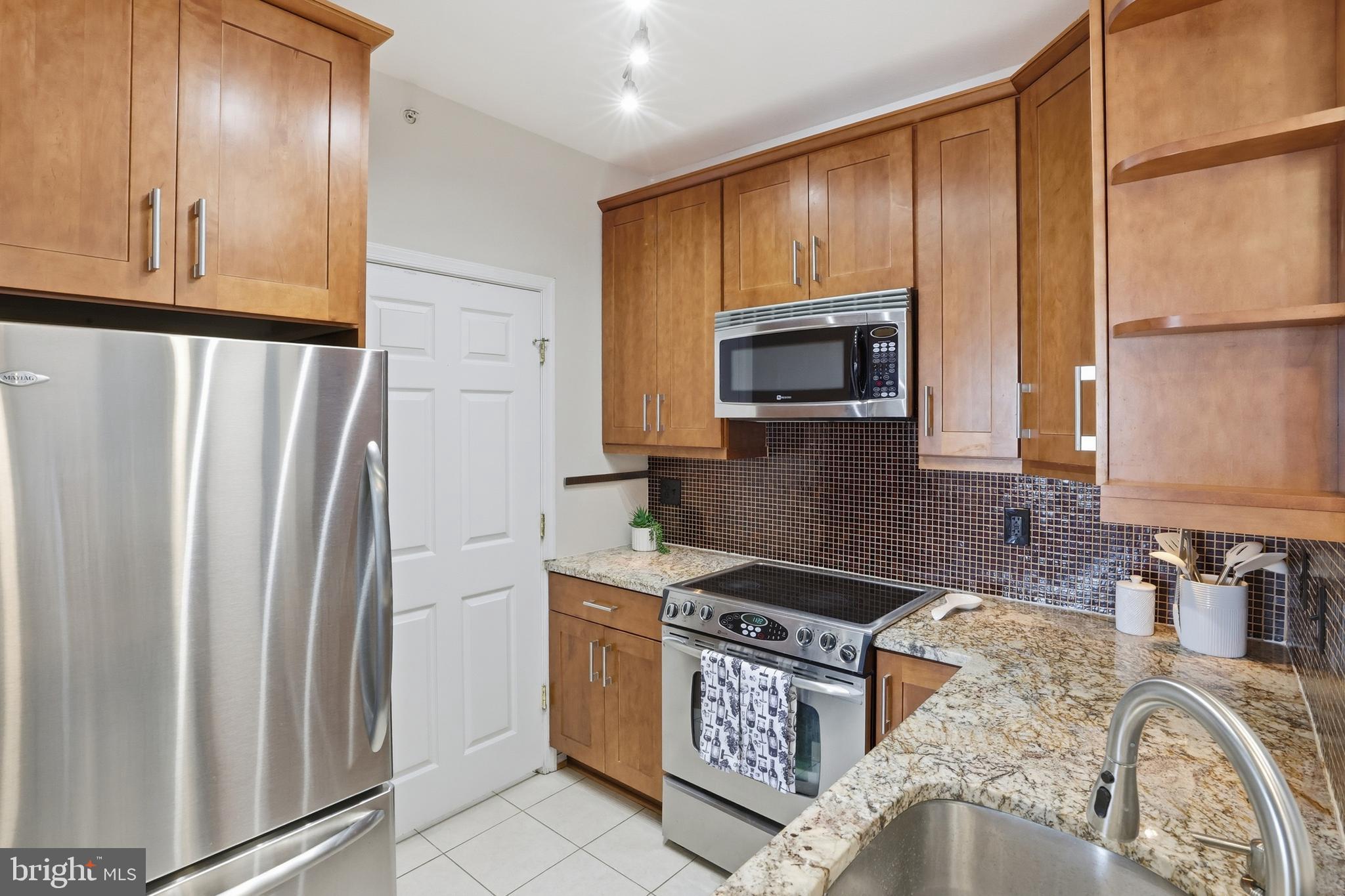 1580 Spring Gate Dr., Unit 4406 McLean, VA 22102 - Photo 17 of 43 Kitchen with plenty of storage space