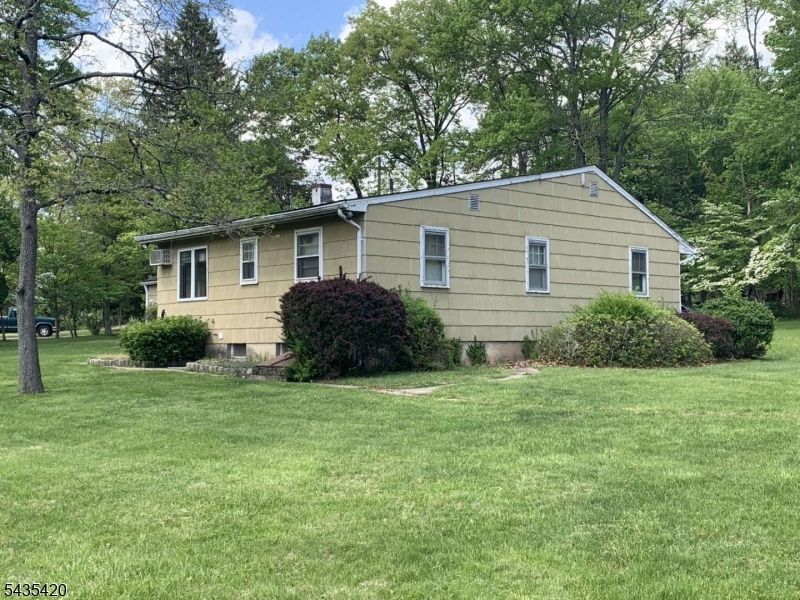 619 Foothill Road Bridgewater, NJ 08807 - Photo 2 of 23 a house that has a big yard with large trees
