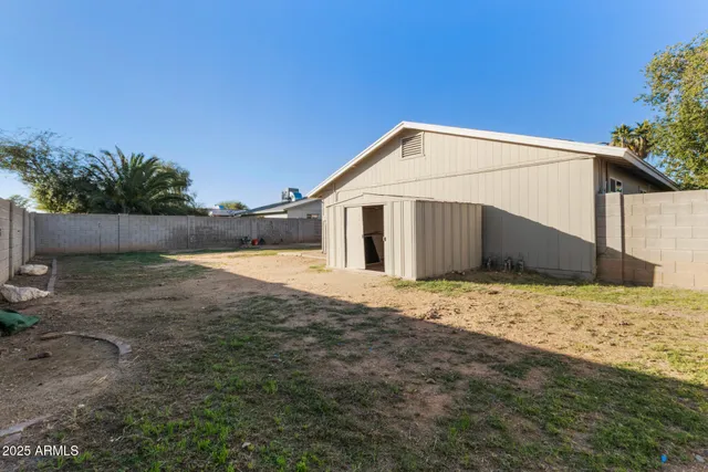 a house view with a backyard space