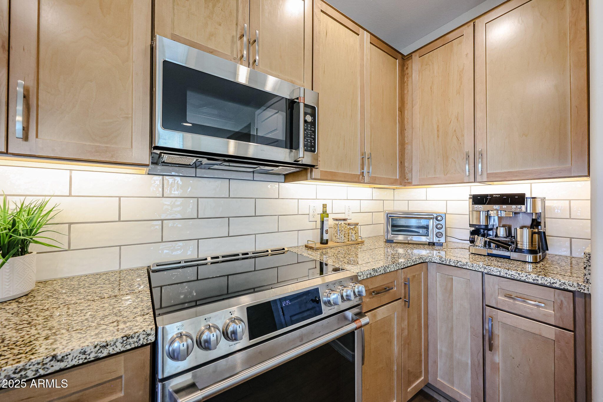 18062 West Amber Ridge Way Goodyear, AZ 85338 - Photo 10 of 68 Stove and Built-in Microwave