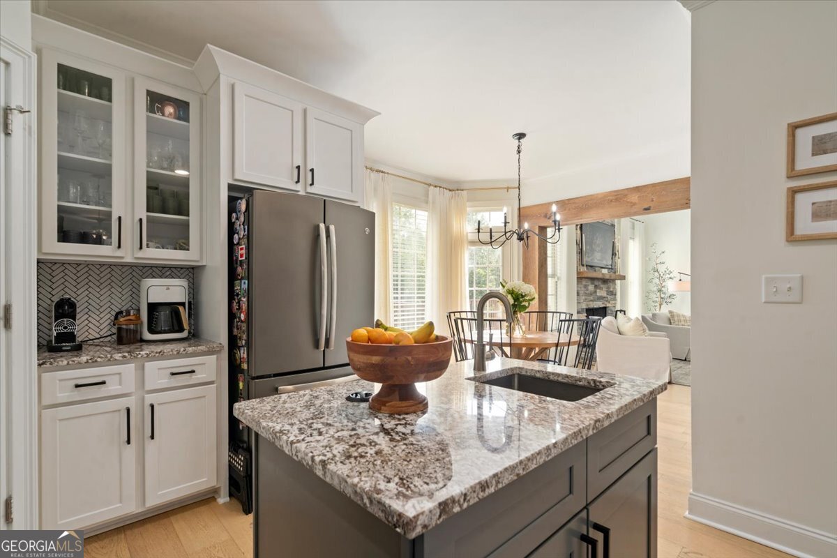 3093 Surry Ridge Drive Watkinsville, GA 30677 - Photo 21 of 41 a kitchen with a table chairs and refrigerator