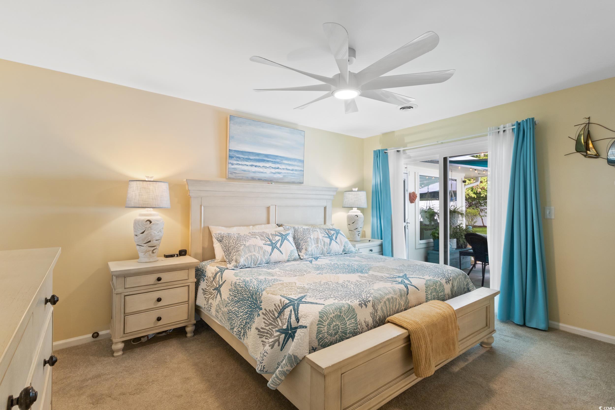 815 Tillson Road North Myrtle Beach, SC 29582 - Photo 17 of 39 Bedroom featuring access to outside, carpet flooring, and ceiling fan