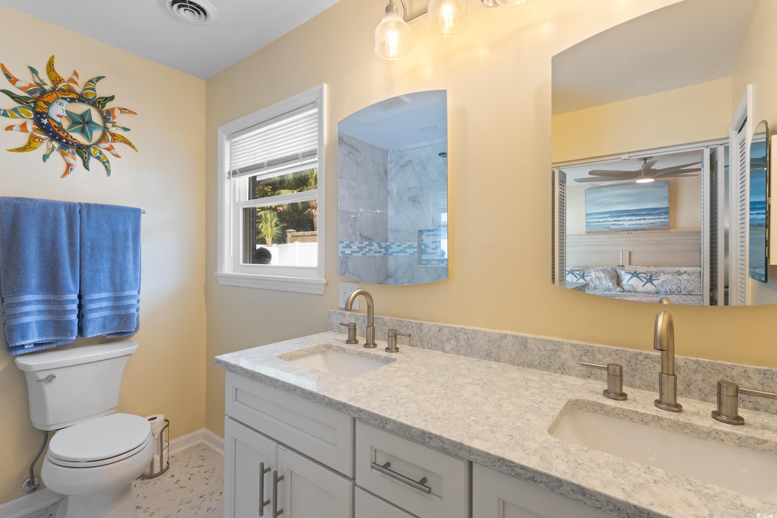 815 Tillson Road North Myrtle Beach, SC 29582 - Photo 20 of 39 Bathroom featuring double vanity and a shower