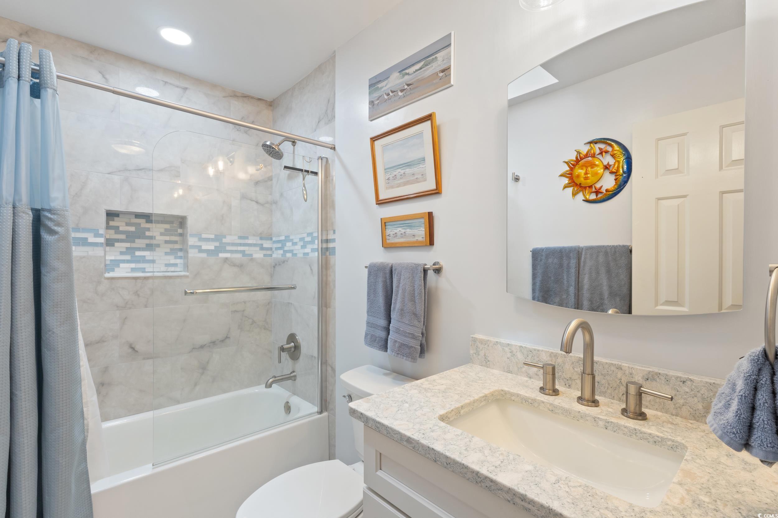 815 Tillson Road North Myrtle Beach, SC 29582 - Photo 25 of 39 Bathroom with vanity and shower / bathtub combination with curtain