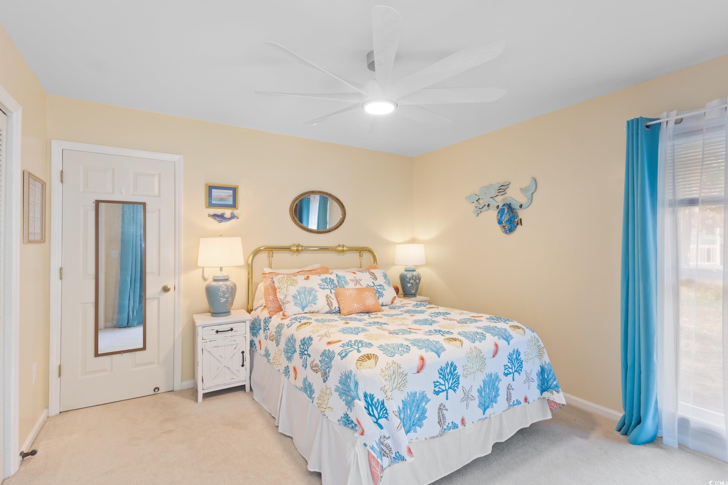 815 Tillson Road North Myrtle Beach, SC 29582 - Photo 28 of 39 Bedroom with light colored carpet and a ceiling fan